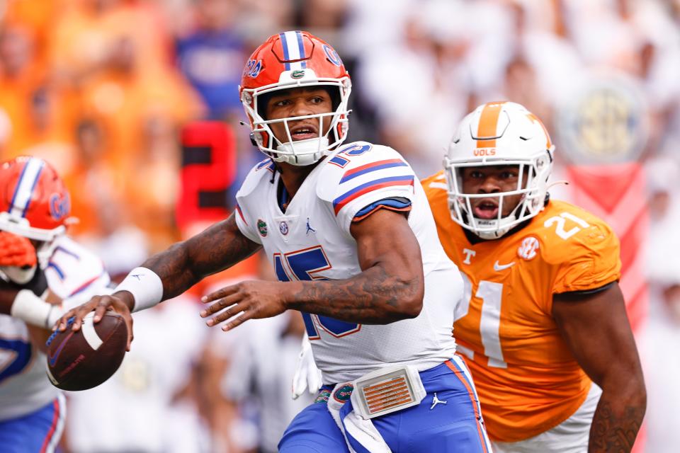 Florida quarterback Anthony Richardson (15) throws to a receiver during the first half of an NCAA college football game against Tennessee, Saturday, Sept. 24, 2022, in Knoxville, Tenn. (AP Photo/Wade Payne)