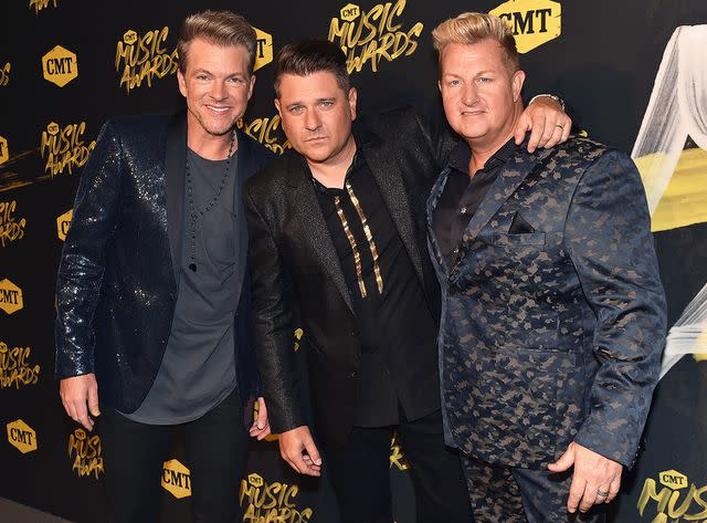 <p>Jeff Kravitz/FilmMagic</p> Joe Don Rooney, Jay DeMarcus and Gary LeVox attend the 2018 CMT Music Awards in Nashville in 2018.