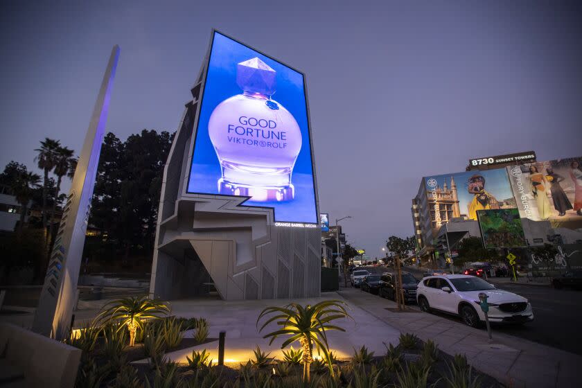 West Hollywood, CA - August 22: A digital billboard, formally known as the Sunset Spectacular, is viewed on the edge of a public parking lot on the Sunset Strip at Sherbourne Drive in West Hollywood Monday, Aug. 22, 2022. It was designed by Tom Wiscombe of Tom Wiscombe Architecture. (Allen J. Schaben / Los Angeles Times)