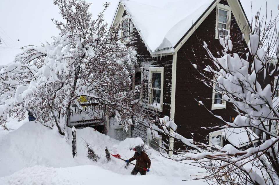 TRUCKEE, CALIFORNIA - MARCH 02: A worker digs out snow from a home north of Lake Tahoe during a powerful multiple day winter storm in the Sierra Nevada mountains on March 02, 2024 in Truckee, California. Blizzard warnings were issued with snowfall of up to 12 feet and wind gusts over 100 mph expected in some higher elevation locations. Yosemite National Park is closed and a 50-mile stretch of Interstate 80 was shut down yesterday due to the storm. (Photo by Mario Tama/Getty Images) ORG XMIT: 776114505 ORIG FILE ID: 2053530457