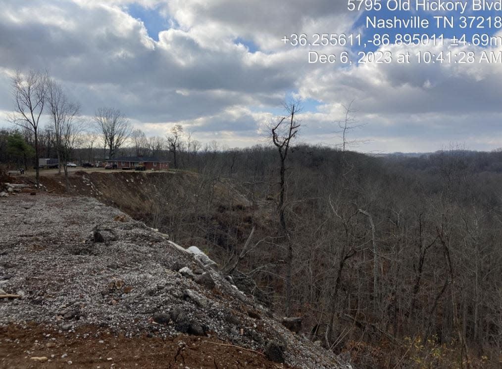 Debris and fill covers a hillside at a property on Old Hickory Boulevard near Beaman Park in Nashville, as shown in Tennessee Department of Environment and Conservation inspection records dated Dec. 6, 2023.