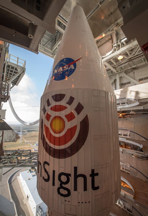 The InSight lander sits atop the Atlas V rocket inside the nose cone, or fairing.