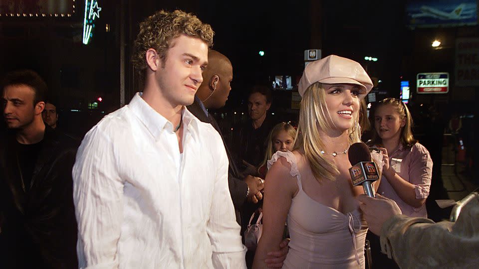 Britney Spears and then-boyfriend Justin Timberlake arrive at the premiere of her movie "Crossroads" in 2002. - Kevin Winter/Getty Images