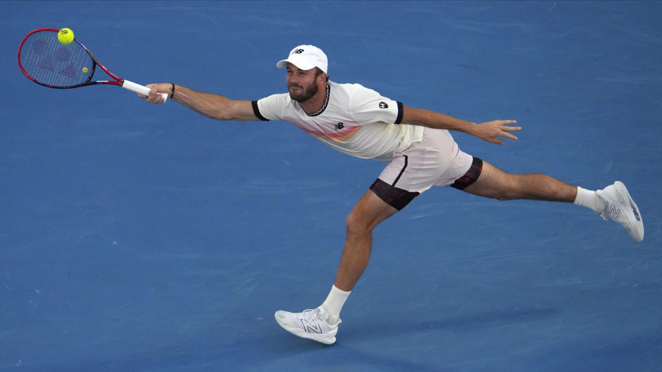 Tommy Paul of the U.S. plays a forehand return to Novak Djokovic of Serbia during their semifinal at the Australian Open tennis championship in Melbourne, Australia, Friday, Jan. 27, 2023. (AP Photo/Ng Han Guan)