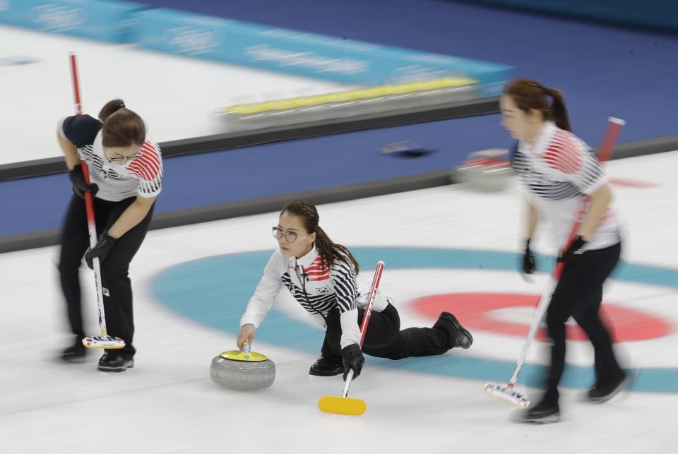 Kim Eun-jung, of South Korea, throws during their women’s curling final in the Gangneung Curling Centre at the 2018 Winter Olympics in Gangneung, South Korea, Sunday, Feb. 25, 2018. (AP Photo/Natacha Pisarenko)