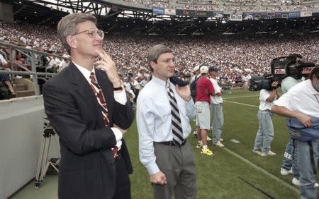 Penn State athletic director Tim Curley (L) and Penn State president Graham Spanier watch the Nittany Lions' football game against Texas Tech from the sidelines of Beaver Stadium in State College, Pennsylvania in this September 9, 1995 file photo. REUTERS/Craig Houtz/Files