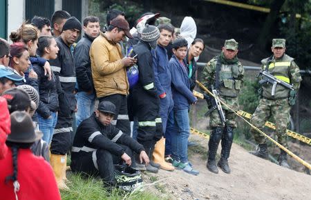 People wait for news after an explosion at an underground coal mine on Friday, in Cucunuba, Colombia June 24, 2017. REUTERS/Jaime Saldarriaga