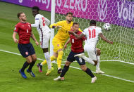 England's Raheem Sterling, right, scores his team's first goal during the Euro 2020 soccer championship group D match between the Czech Republic and England at Wembley stadium, London, Tuesday, June 22, 2021. (Neil Hall/Pool Photo via AP)