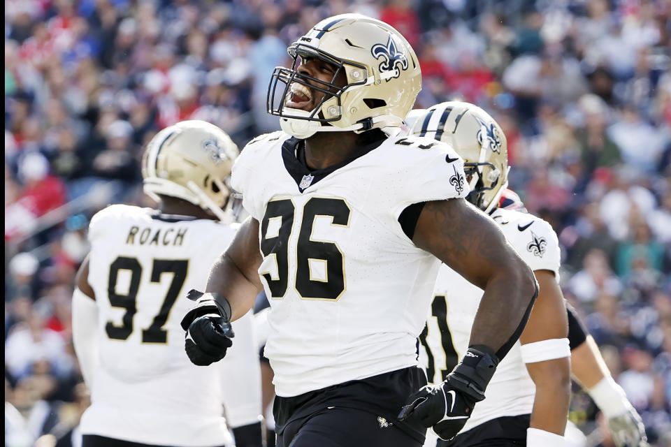FOXBOROUGH, MASSACHUSETTS – OCTOBER 08: Carl Granderson #96 of the New Orleans Saints celebrates after a tackle for a loss during the third quarter against the New England Patriots at Gillette Stadium on October 08, 2023 in Foxborough, Massachusetts. (Photo by Winslow Townson/Getty Images)