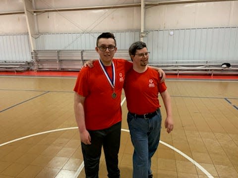 Chris Dockery, left, and Alex "Popcorn Boss" Brown serve as two of the Special Olympics Ambassadors for Madison County's program.