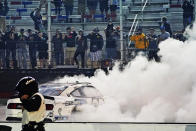 Chase Briscoe does a burnout as he celebrates winning the NASCAR Xfinity Series auto race Friday, Sept. 18, 2020, in Bristol, Tenn. (AP Photo/Steve Helber)