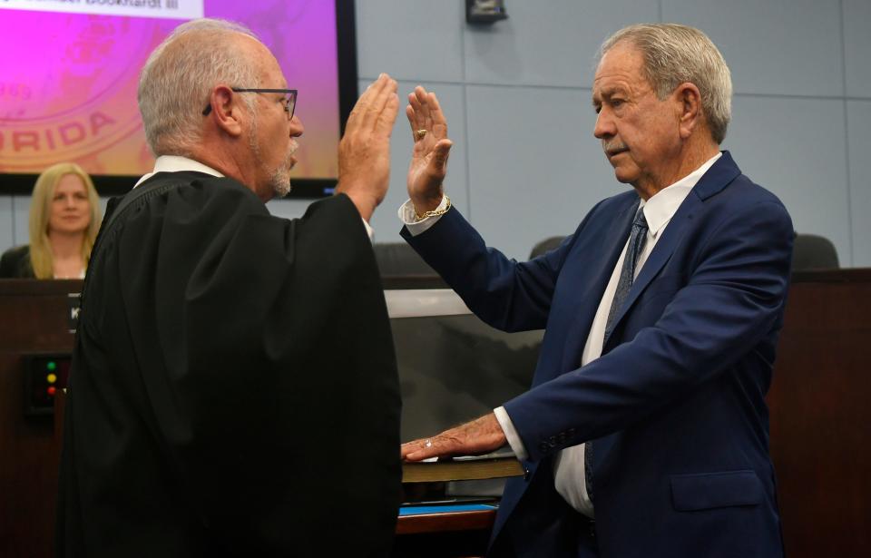 Judge Charles Roberts (a former Brevard County commissioner) swears in Tom Goodson, District 2, during the Nov. 22, 2022, organizational meeting of the Brevard County Board of County Commissioners in Viera. The meeting began with the swearing in ceremonies of two new commissioners. Also sworn in was Rob Feltner, District 4, by Judge Samual Bookhardt III.