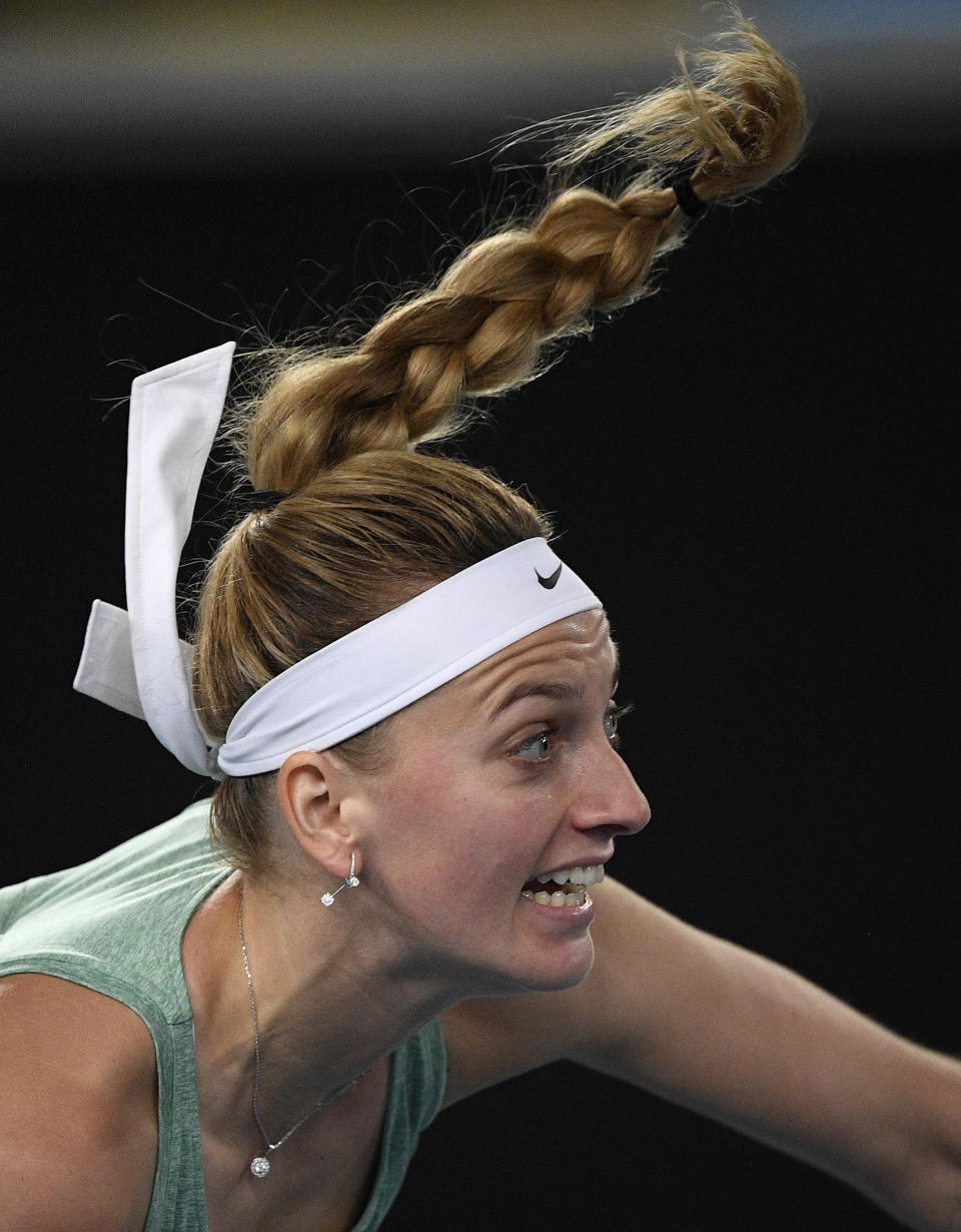 Petra Kvitova of the Czech Republic serves to United States' Venus Williams during a tuneup tournament ahead of the Australian Open tennis championships in Melbourne, Australia, Tuesday, Feb. 2, 2021. (AP Photo/Andrew Brownbill)