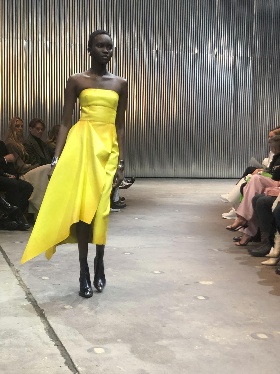 A model walks the runway wearing fashion from the Alexander McQueen Autumn/Winter 2022 collection on Tuesday, March 15, 2022 in New York. (AP Photo/Leanne Italie)