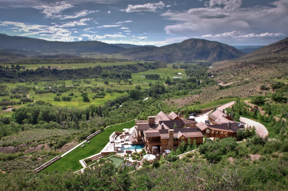 A putting green accompanies private trails, saltwater pool, and private beach at this Showmass mansion.