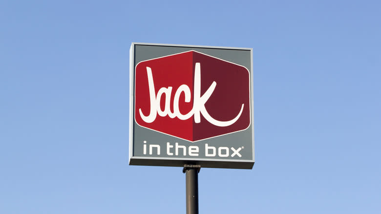 jack in the box restaurant sign against sky