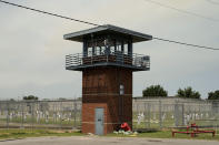 Prisoners walk through a yard at the Varner Unit of Arkansas' Department of Corrections, Friday, Aug. 18, 2023, in Gould, Ark. The U.S. has a history of locking up more people than any other country, and goods tied to prison labor have morphed into a massive multibillion-dollar empire, extending far beyond the classic images of people stamping license plates or working on road crews. (AP Photo/John Locher)