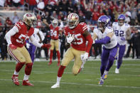 San Francisco 49ers cornerback Richard Sherman (25) runs in front of Minnesota Vikings wide receiver Adam Thielen as 49ers defensive end Dee Ford (55) looks on after Sherman intercepted a pass during the second half of an NFL divisional playoff football game, Saturday, Jan. 11, 2020, in Santa Clara, Calif. (AP Photo/Marcio Jose Sanchez)