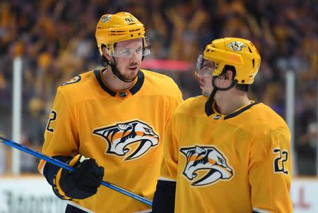 Dec 15, 2018; Nashville, TN, USA; Nashville Predators center Ryan Johansen (92) talks with Nashville Predators left wing Kevin Fiala (22) during the first period against the New Jersey Devils at Bridgestone Arena. Mandatory Credit: Christopher Hanewinckel-USA TODAY Sports