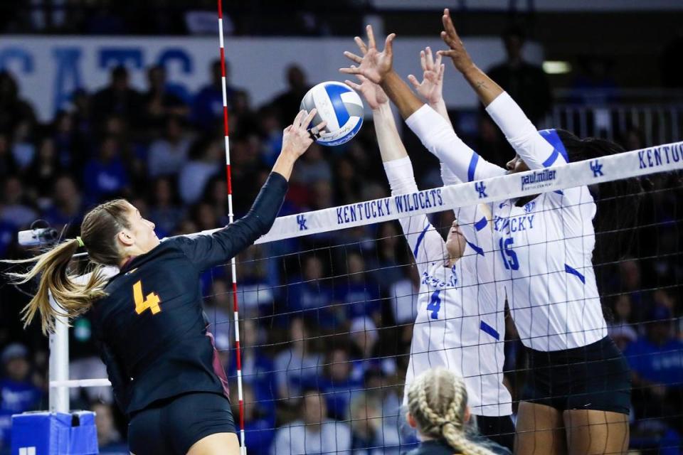 Kentucky’s Emma Grome (4) and Azhani Tealer (15) try to block a shot from Loyola (Chicago) in Memorial Coliseum on Thursday night.