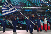 <p>Flag bearer Sophia Ralli of Greece leads the team, who all wear a monochromatic navy winter outfit with “Hellas” printed on the trousers during the opening ceremony of the 2018 PyeongChang Games. (Photo: Quinn Rooney/Getty Images) </p>