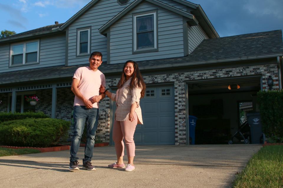 Dil Khadka, pictured with his wife, Sarmila Gurung, at their Reynoldsberg home, released his second album last month. A native of Bhutan who once lived in a Nepali refugee camp, his latest work explores themes of longing, frustration and love.