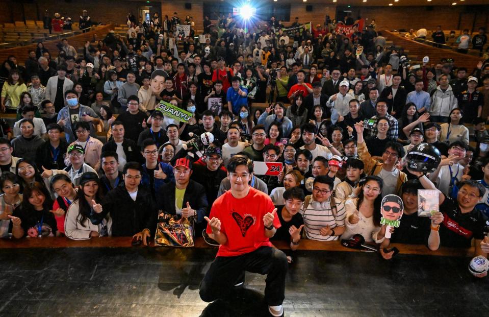 <span>Zhou Guanyu poses for a pictures with fans after the world premiere of the The First One in Shanghai this week.</span><span>Photograph: Héctor Retamal/AFP/Getty Images</span>