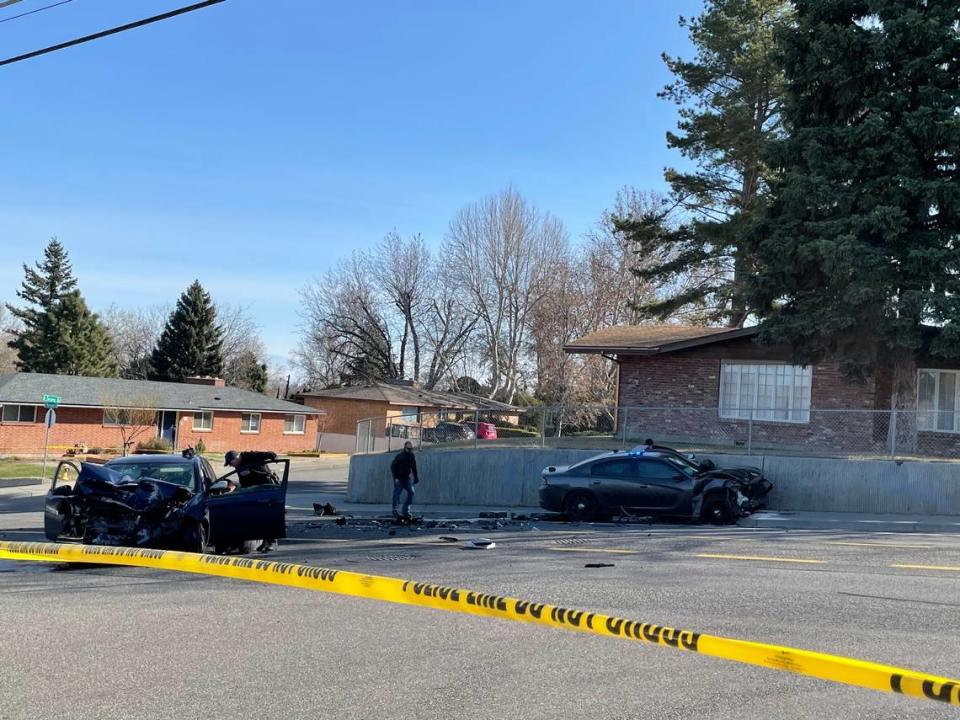 A woman is dead after an early morning crash in Kennewick that started with a shot fired at a police car, followed by a chase involving a Benton County sheriff’s deputy.