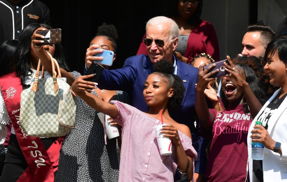 Joe Biden poses for selfies while visiting with students at Texas Southern University in Houston. (Photo: Frederic J. Brown/AFP/Getty Images)