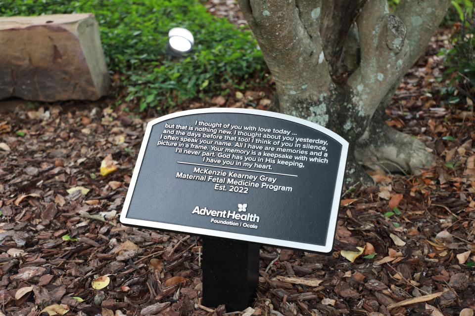 A garden plaque commemorates the life of McKenzie Kearney Gray.