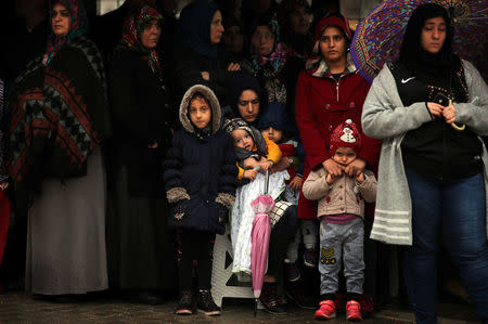 Relatives of Sahin Elitas, a civilian who was killed in a rocket attack fired by Syria, mourn during his funeral ceremony in the town of Kirikhan in Hatay province, Turkey January 23, 2018. REUTERS/Umit Bektas