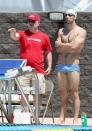 Coach Bob Bowman talks with Michael Phelps as he practices for the Arena Grand Prix at the Skyline Aquatic Center in Mesa, Arizona on April 23, 2014