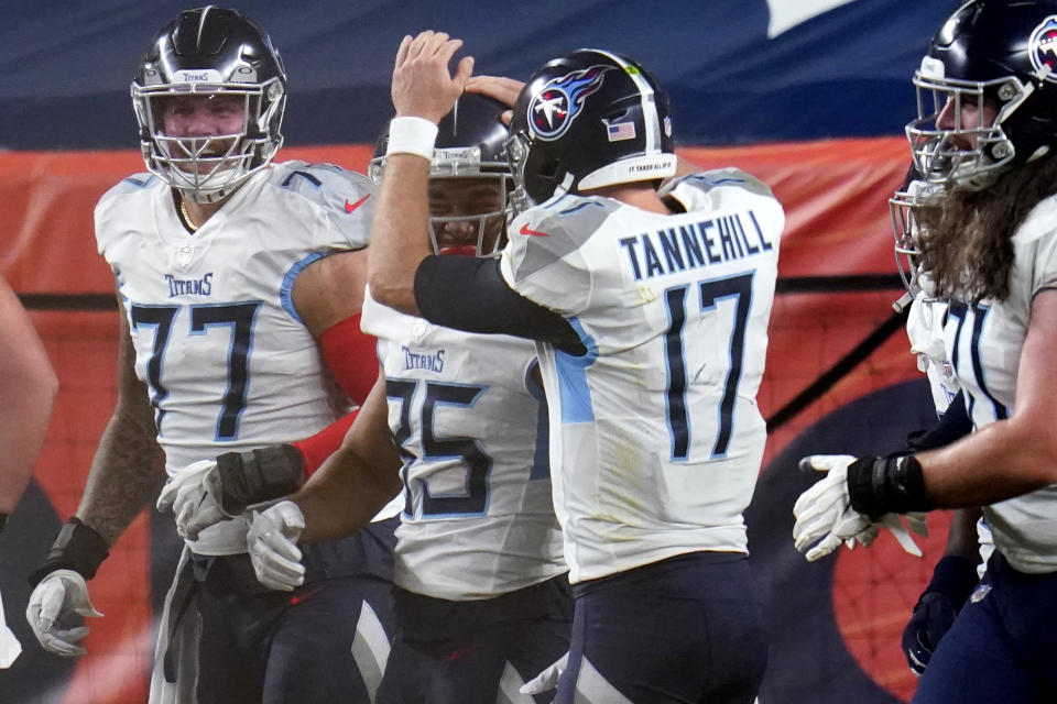 Tennessee Titans tight end MyCole Pruitt (85) celebrates his touchdown with quarterback Ryan Tannehill (17) during the first half of an NFL football game against the Denver Broncos, Monday, Sept. 14, 2020, in Denver. (AP Photo/Jack Dempsey)