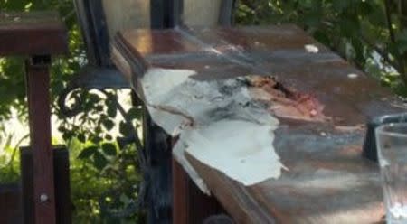 Damage on a bartop is seen at a cafe after a shooting during a local festival in the village of Zitiste, north of Belgrade, Serbia in this still image from video taken July 2, 2016. Courtesy of N1 via REUTERS TV