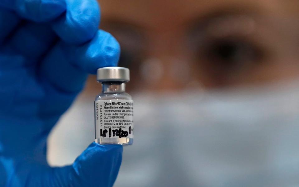 A nurse holds a phial of the Pfizer-BioNTech COVID-19 vaccine at Guy's Hospital in London  - Getty