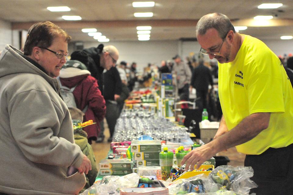 Diane Hale of Ashland County chats with vendor Anthony J. Wenig of Bowling Green about the farm toys he is selling during the FFA Alumni Farm Toy show Sunday.