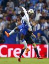 Bayern Munich's Thomas Mueller (R) and Porto's Bruno Martins Indi fight for the ball during their Champions League quarterfinal first leg soccer match at Dragao stadium in Porto April 15, 2015. REUTERS/Miguel Vidal