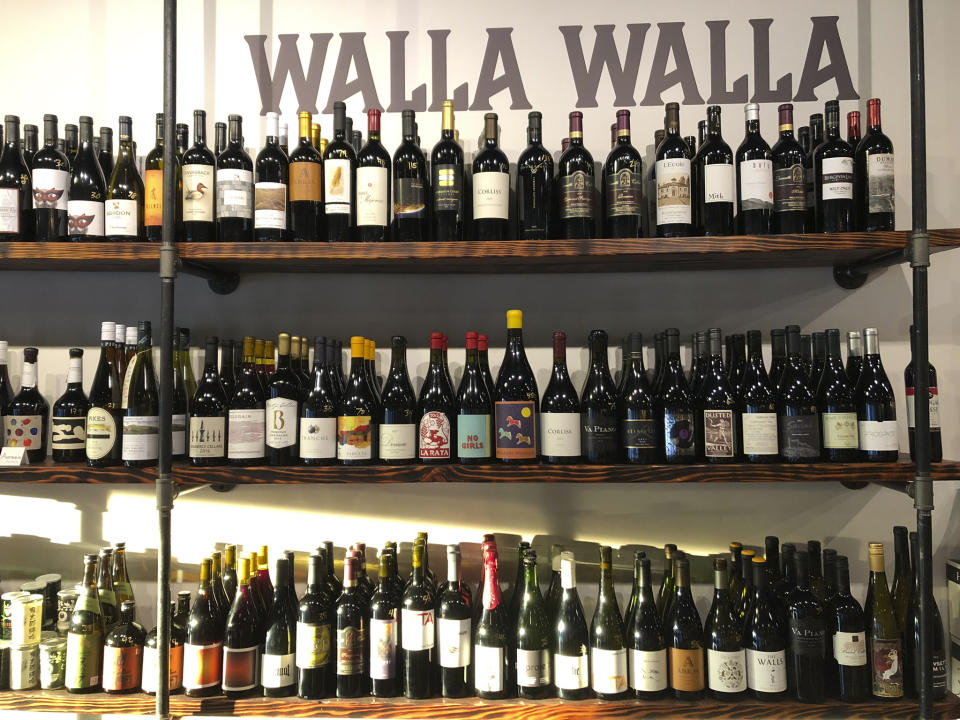 This Aug. 12, 2019 photo shows a selection of local wines at The Thief wine bar and bottle shop in Walla Walla, Wash. Southeastern Washington has been producing high-quality wines for decades. But in the past five years, the wineries of the Walla Walla Valley have drawn international accolades for the reds produced from the unique soil just across the border in Oregon. (AP Photo/Sally Carpenter Hale)