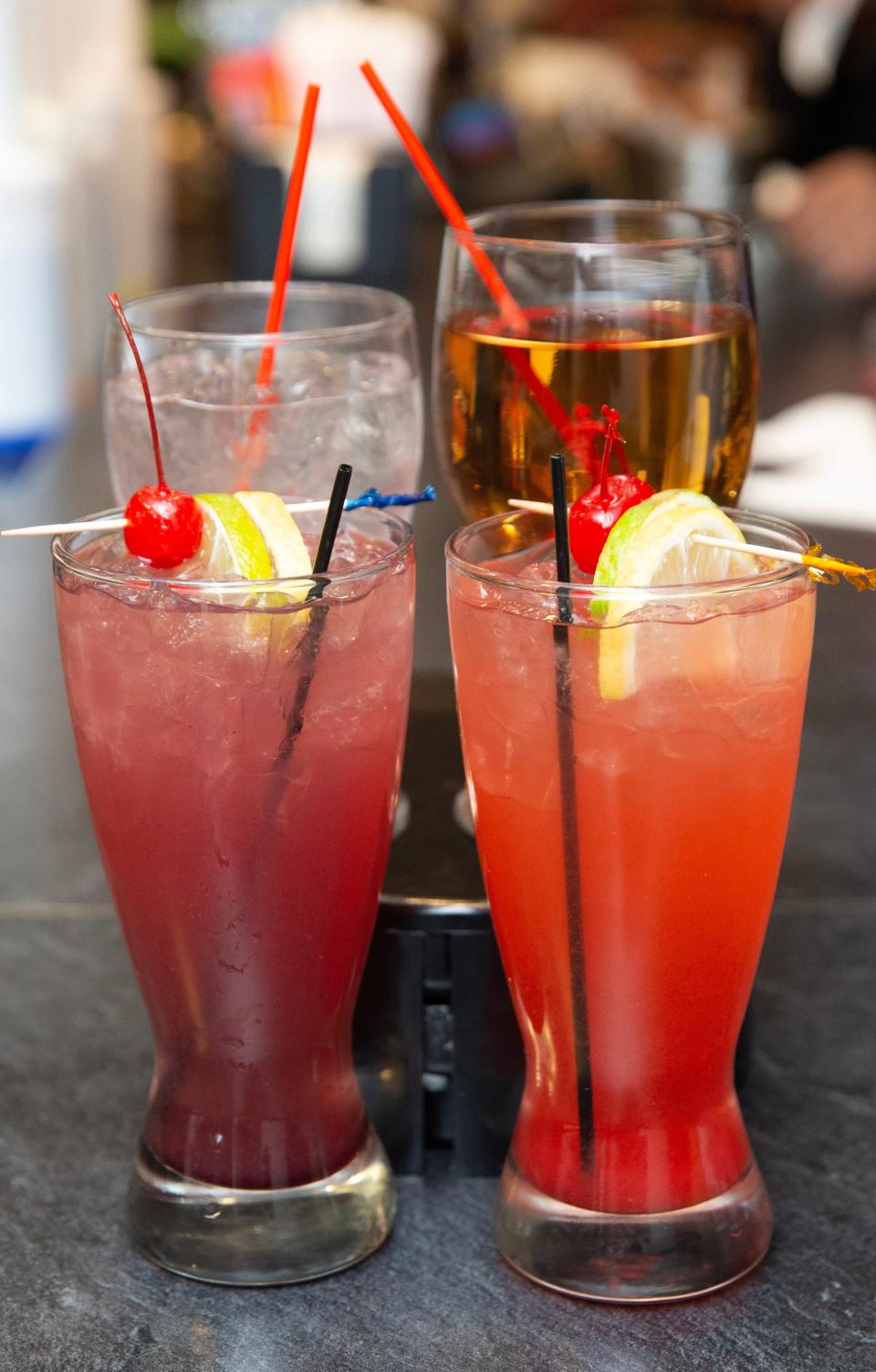 Starz in downtown Canton serves signature drinks, including front from left, the Purple Rain and Strawberry Passion, and back from left, Starz Ice Water and house wine.