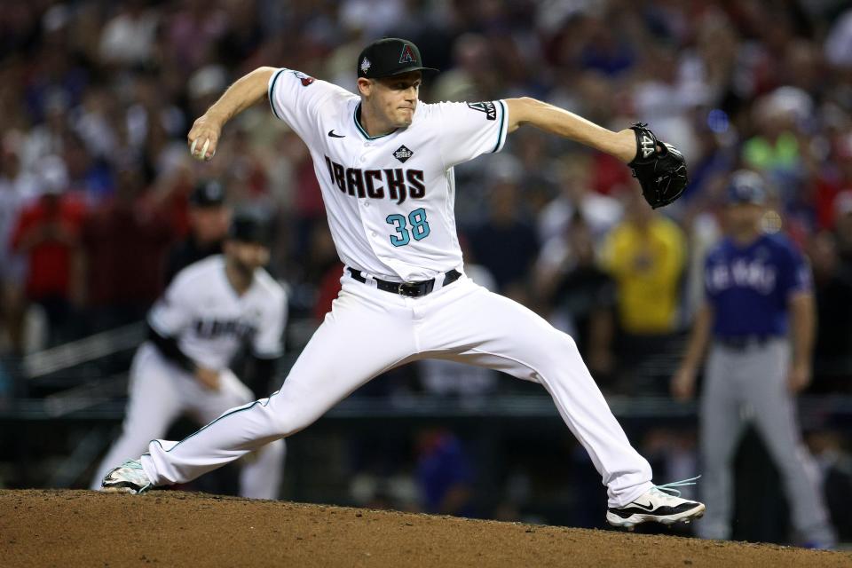 Paul Sewald #38 of the Arizona Diamondbacks pitches in the ninth inning against the Texas Rangers during Game Five of the World Series at Chase Field on Nov. 1, 2023, in Phoenix.