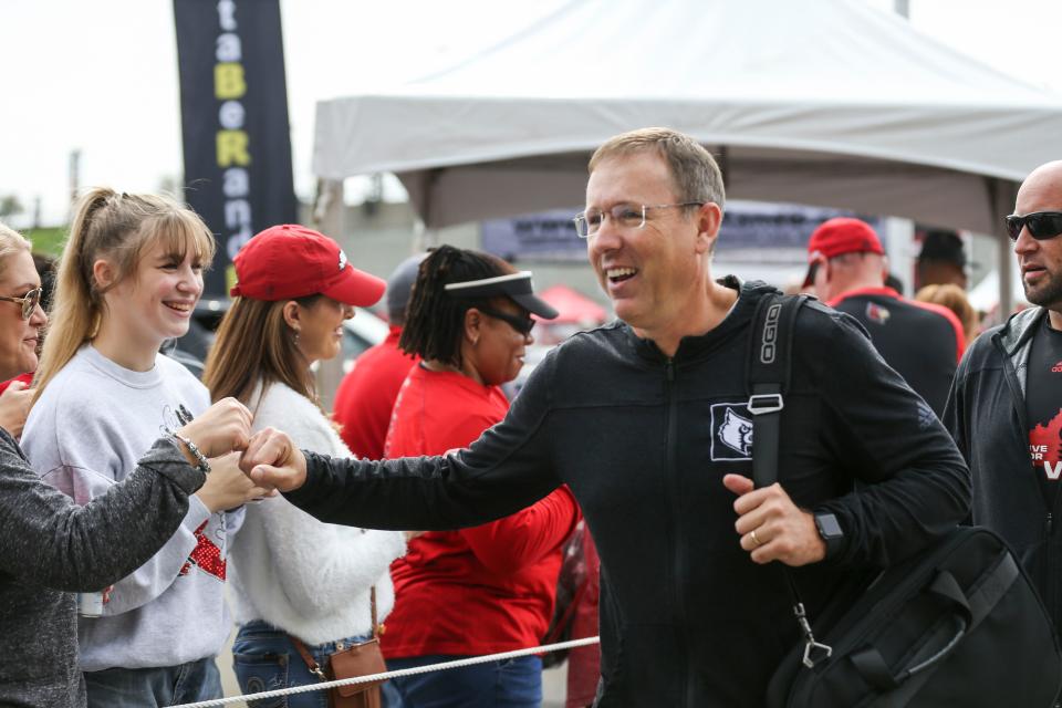 Louisville head football coach Scott Satterfield greet fans during the Cardmarch before the game against Boston College Saturday at Cardinal Stadium. Oct. 23, 2021