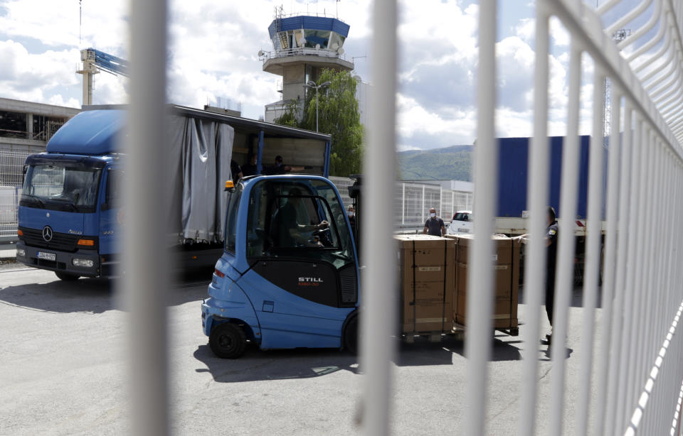 Civil protection workers move boxes of ventilators at the customs post in the Bosnia capital Sarajevo, Thursday, April 30, 2020. In their initial report, the Bosnian state prosecutors said in a statement released Monday May 11, 2020, that the ventilators imported from China by private company Silver Raspberry, and paid for by the country’s government, have been found to be useless for COVID-19 coronavirus patients. (AP Photo)