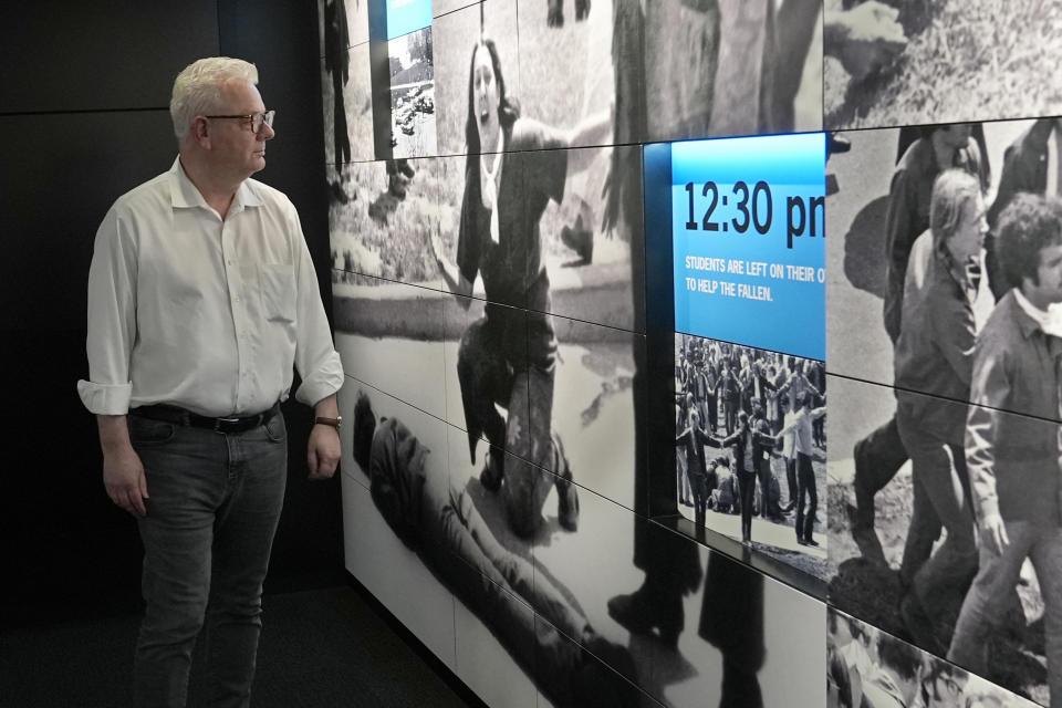 Neil Cooper, Kent State University professor and director of the School of Peace and Conflict Studies, looks at a display at the May 4 Visitors Center at KSU, Wednesday, May 1, 2024, in Kent, Ohio. Kent State University is marking another solemn anniversary of the National Guard shootings that killed four unarmed students and wounded nine others on May 4, 1970. (AP Photo/Sue Ogrocki)