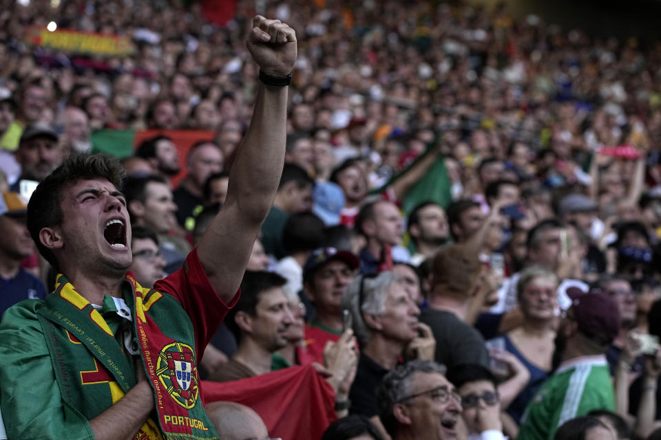 A Portugal supporter reacts during the singing of the team's national anthems before the start of the Rugby World Cup Pool C match between Australia and Portugal at the Stade Geoffroy Guichard in Saint-Etienne, France, Sunday, Oct. 1, 2023. (AP Photo/Laurent Cipriani)