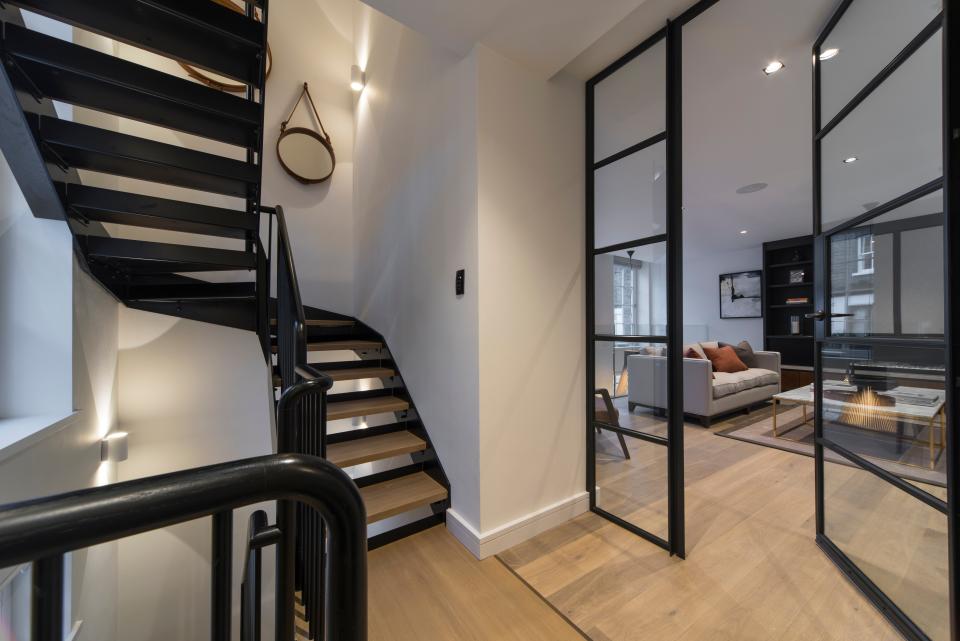 A winding staircase connects the home’s multiple levels.