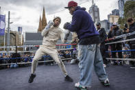 American boxer Devin Haney boxes during a public training session at Federation Square in Melbourne, Australia, Thursday, June 2, 2022. U.S.-based Australian boxer George Kambosos will put his WBA, IBF and WBO belts on the line on Sunday at Melbourne's Marvel Stadium to fight American Devin Haney. (Diego Fedele/AAP Image via AP)