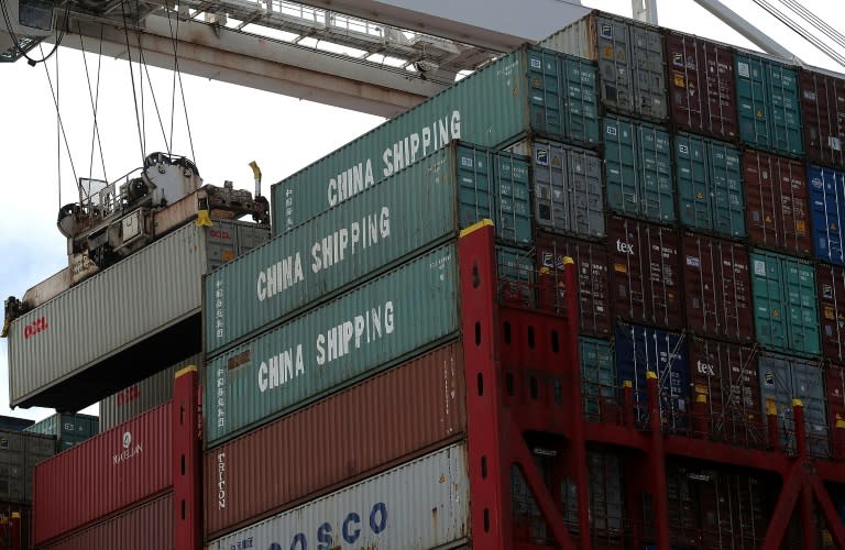 A shipping container is offloaded from the Hong Kong based CSCL East China Sea container ship at the Port of Oakland on June 20, 2018 in Oakland, California