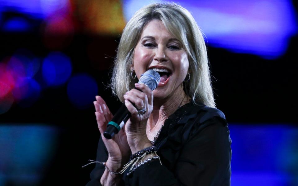 Olivia Newton-John remains one of Britain's biggest global stars today - AP