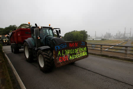 French farmers, members of the FNSEA, the country's largest farmers' union, arrive with their tractors to block the French oil giant Total refinery in Donges, France, June 11, 2018. REUTERS/Stephane Mahe