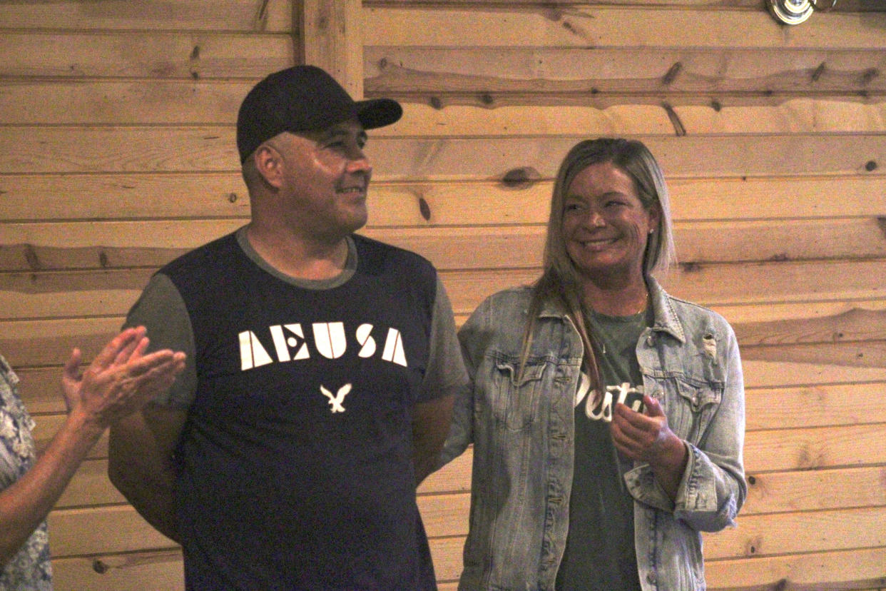 David Hurtado (left) and Kristy Timreck attend a dinner and fundraiser Saturday, May 18, at Howell Eagles No. 3607. Their families were displaced after an April fire at the Hampton Ridge condo complex in Genoa Township.